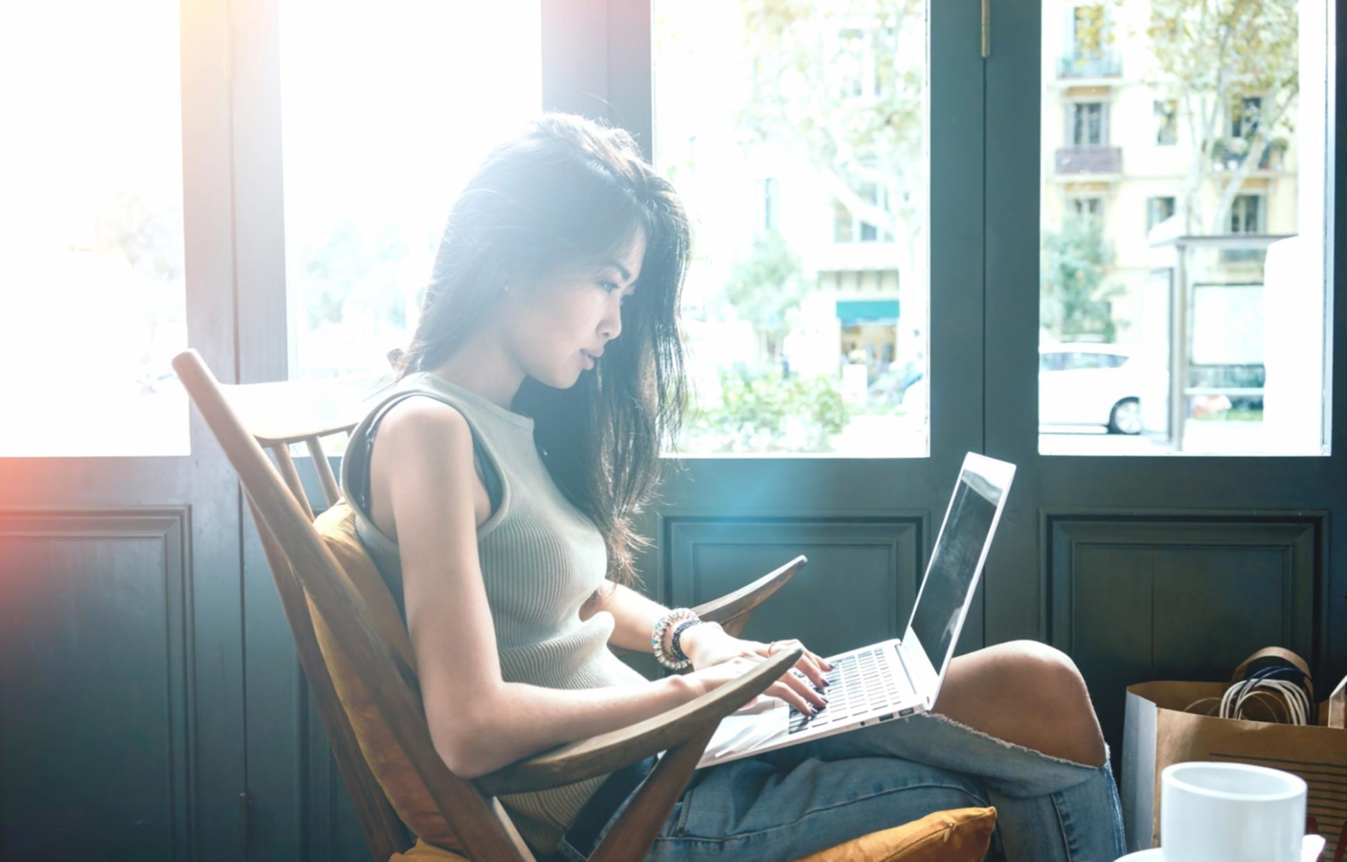 Person practicing yoga breathing exercises in peaceful setting